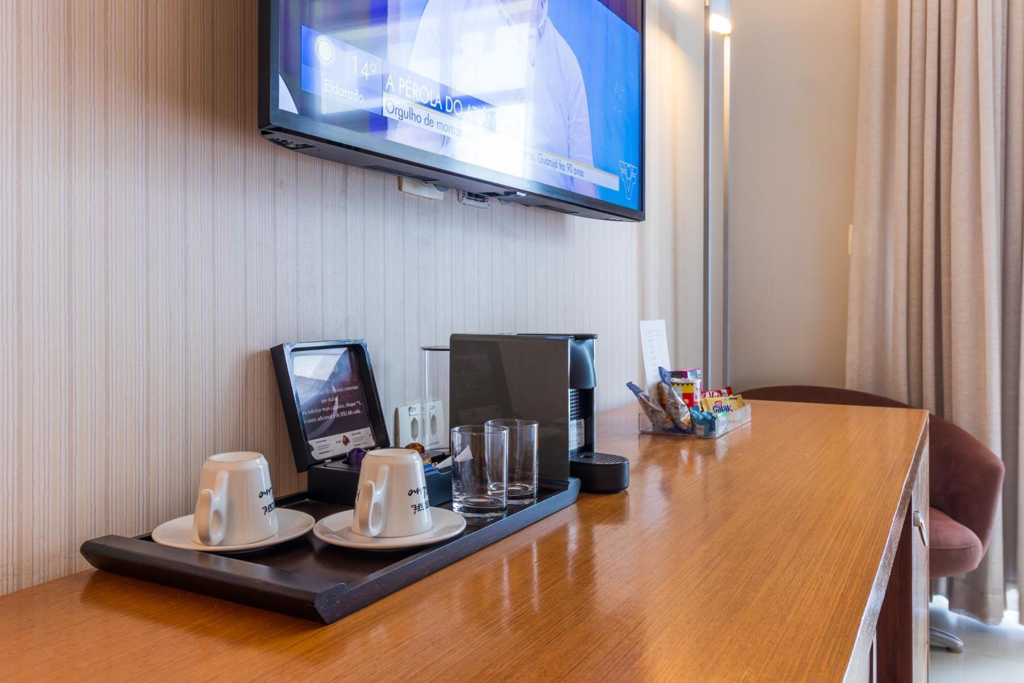 Parque Balneario Hotel Santos By Castelo Itaipava ห้อง รูปภาพ A Nespresso machine in a hotel room